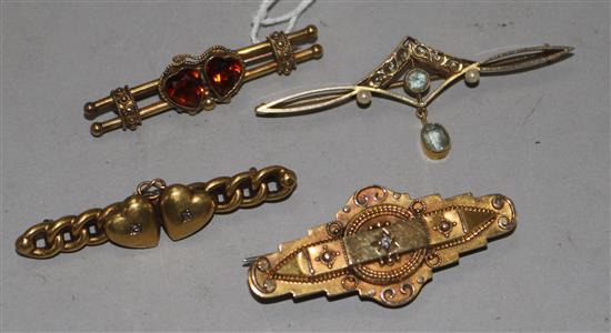 Three late 19th/ early 20th century 15ct gold and gem set bar brooches and a similar 9ct gold bar brooch, longest 54mm.